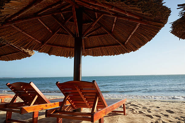 istock sun lounger under an umbrella on the beach 584789360