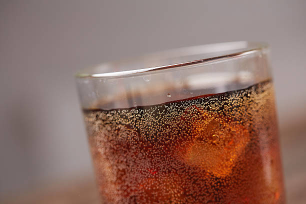 istock whiskey with cola with ice closeup 584789906
