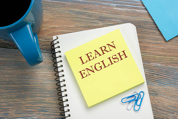 istock Learn English Text written on notebook page, red pencil and 584790120