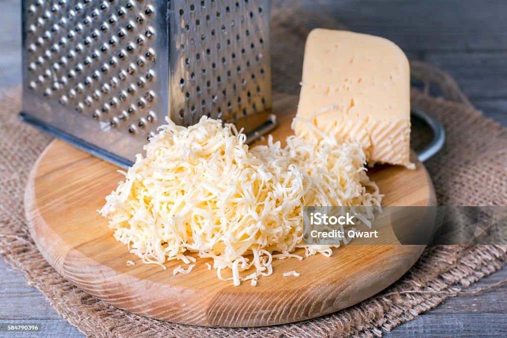 Grated cheese with grater Cheese Stock Photo