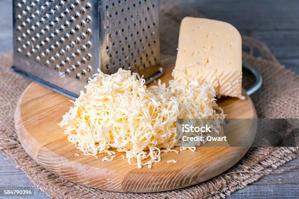 Grated Cheese With Grater Stock Photo - Download Image Now - Cheese, Grated, Grater - Utensil