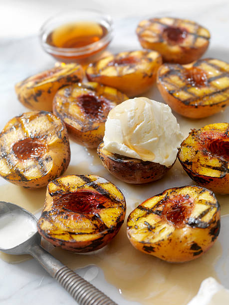 istock Grilled Peaches with Vanilla Ice Cream and Maple Syrup 584791550