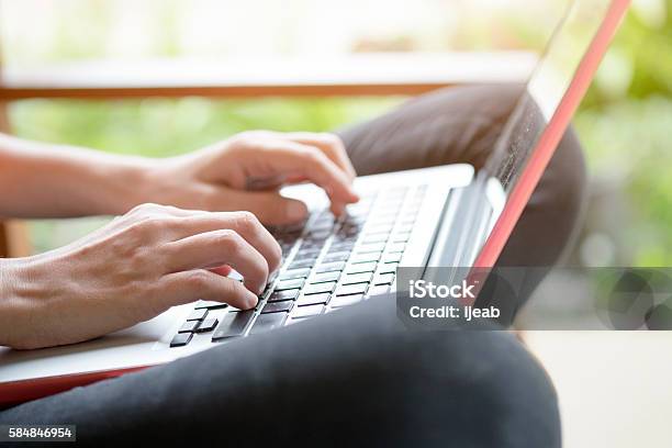 Young Woman Using Computer Laptop Stock Photo - Download Image Now - Adult, Backgrounds, Business