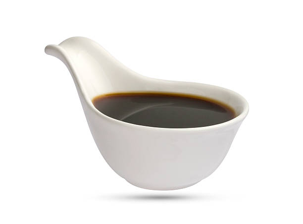 istock Dish of soy sauce isolated on white 584847478