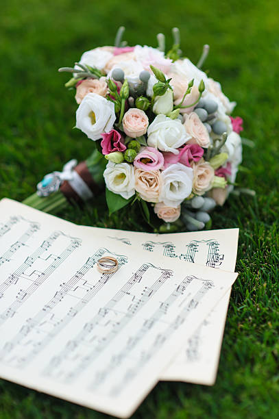 istock Wedding rings on a sheet of paper with notes 584848744