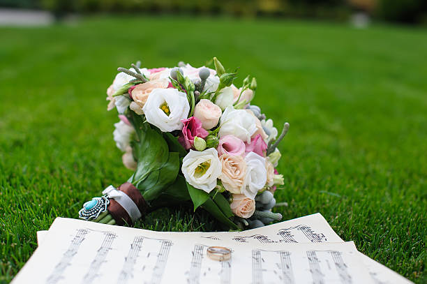 Wedding rings on a sheet of paper with notes