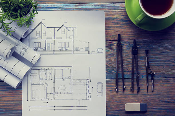 istock Architect worplace top view. Architectural project, blueprints, blueprint rolls and 584849660