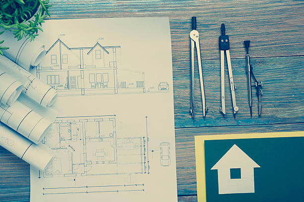 istock Real Estate concept. Architectural project, blueprints, blueprint rolls and  divider 584850932