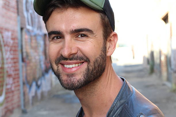 istock Trendy style looking man smiling happy 584851118