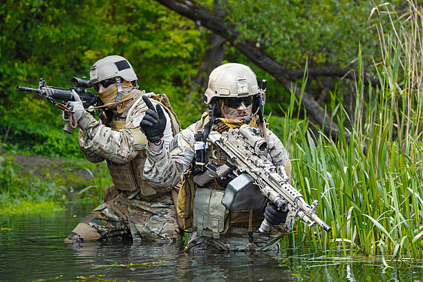 Green Berets soldiers in action Green Berets US Army Special Forces Group soldiers in action snakes beard stock pictures, royalty-free photos & images