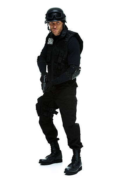 istock Police in action with handgun 584852952