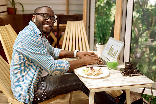 istock Joyful man working on the laptop 584856238