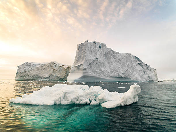 huge glaciers are on the arctic ocean in ilulissat, greenland - icecap imagens e fotografias de stock