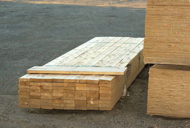 istock wood planks stacked on construction site 584857828