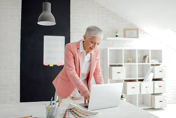 istock Mature Businesswoman Working In Her Office. 584858012