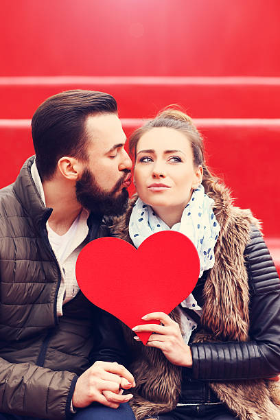 istock Romantic couple holding heart 584858574