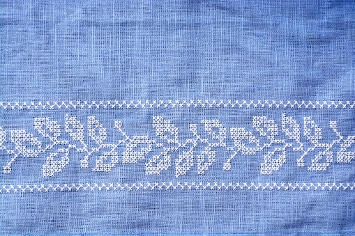 Background of close up from embroidery tea towel in the kitchen with empty copy space