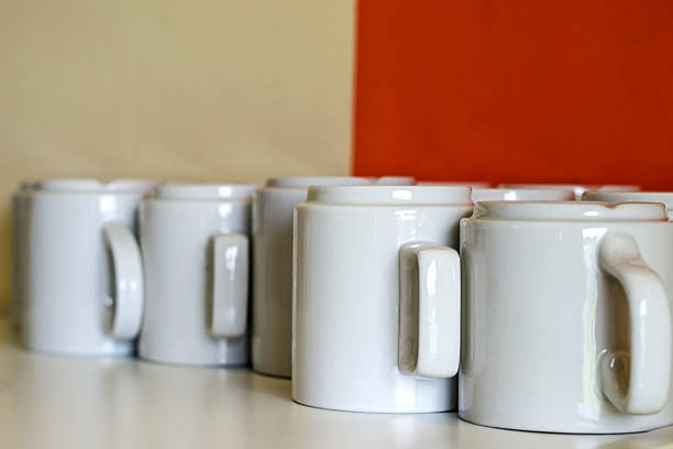 istock row of white porcelain mugs 584861486
