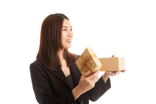 Young Asian business woman open a gift box  isolated on white background.
