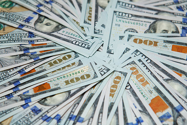 istock Background of 100 dollar bills 584864282