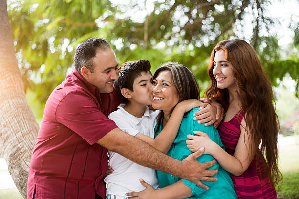 istock Playful and affectionate latin family of four 584864426