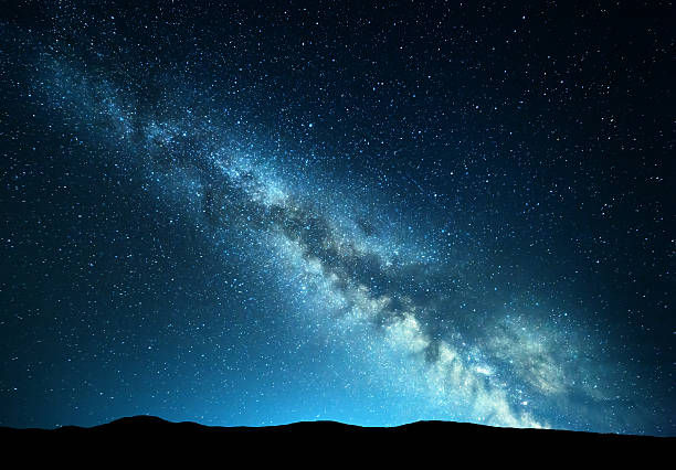 istock Night landscape at mountains with colorful Milky Way 584864646