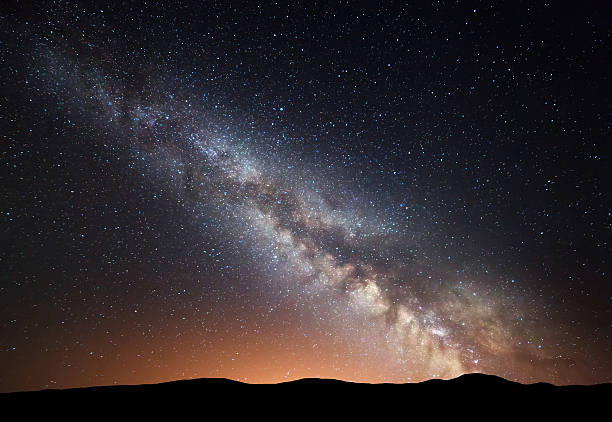 istock Night landscape at mountains with colorful Milky Way 584865062