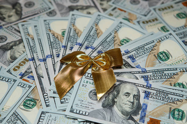 istock Dollars background - abstract business money texture 584865174
