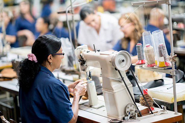 Textile Factory Workers On Sewing Machines