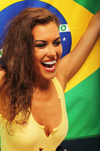 istock Happy Brazilian fan cheering with flag 584869306
