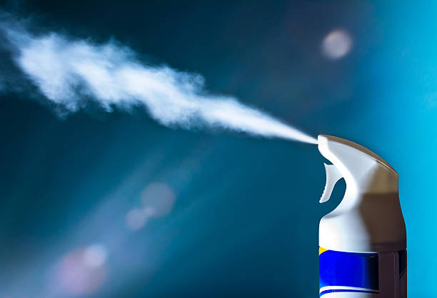 Air freshener spray aerosols in the light of sun stock photo