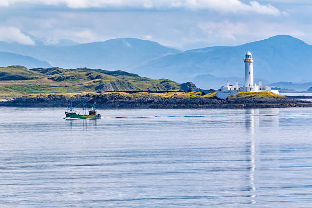 Eilean Musdile Lighthouse Lighthouse on Eilean Musdile, just off Lismore Island between Oban and Isle of Mull oban stock pictures, royalty-free photos & images