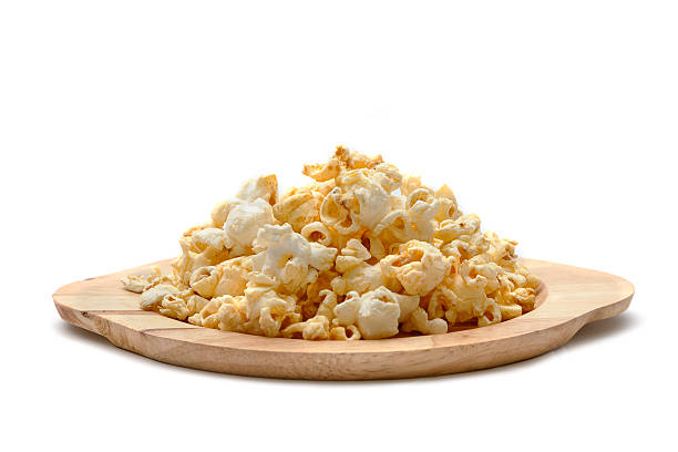 istock Popcorn in wooden plate, Snacks background 584871076