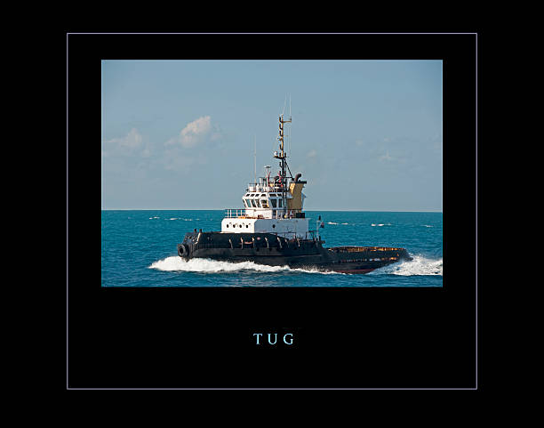 istock Ocean going tugboat framed and with title, black background 584871732