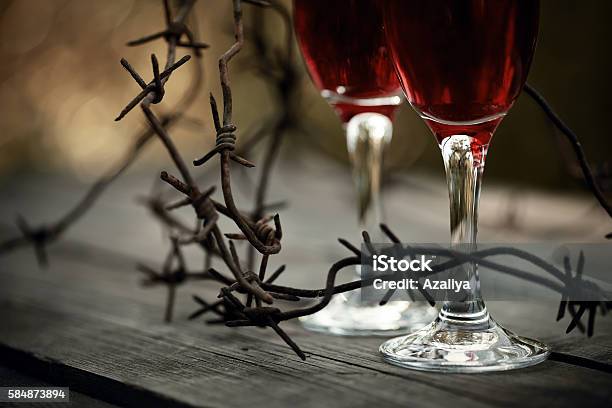 Wine In Glasses And A Barbed Wire Stock Photo - Download Image Now - Abstract, Abuse, Addiction