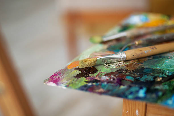 istock palette with paintbrush and palette-knife 584879322