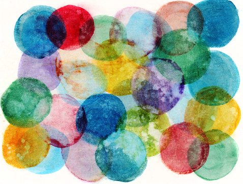 An hand painted background created with watercolors and inks. There are circular formations with texture from splatters of water and paint. There is a distressed texture throughout the painting. There are a variety of many colors.