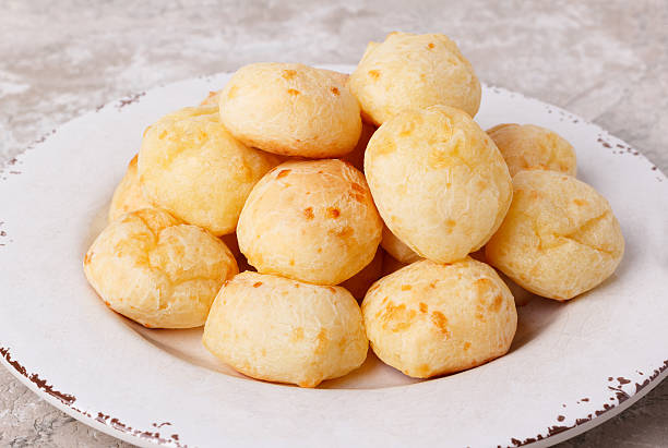 istock Brazilian snack cheese bread (pao de queijo) on plate 584883552