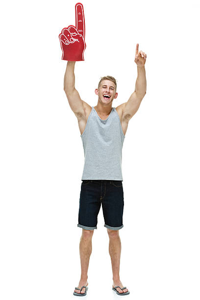 istock Cheerful casual man cheering and pointing 584883652