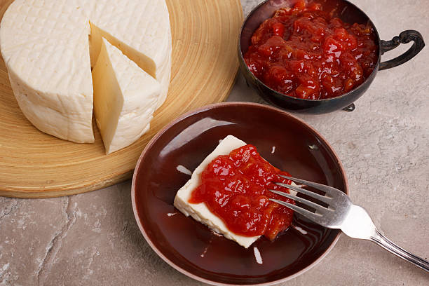 Brazilian dessert Romeo and Juliet, goiabada jam and cheese Minas Brazilian dessert Romeo and Juliet, goiabada jam of guava and cheese Minas on marble table. Selective focus guava photos stock pictures, royalty-free photos & images