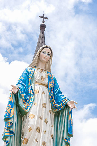 istock Mary the Blessed Virgin , blue sky background 584884102
