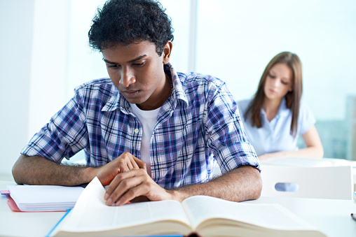 Student boy busy at lesson