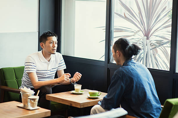 istock Two men in a casual meeting in a Cafe 584888572