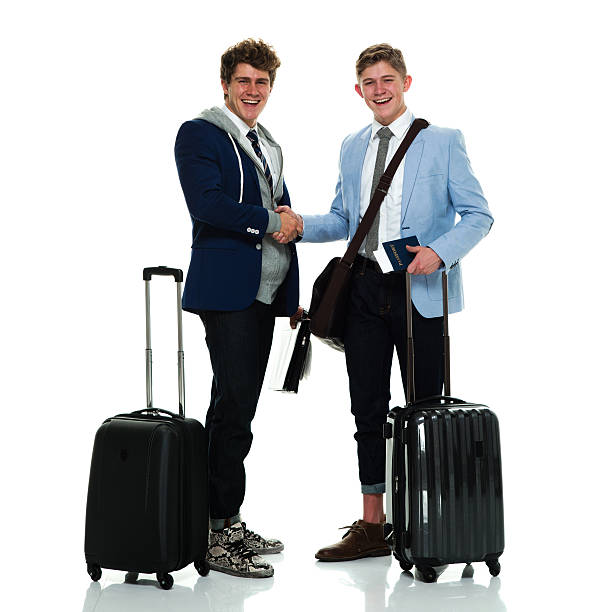 istock Smiling brothers giving handshake 584888602