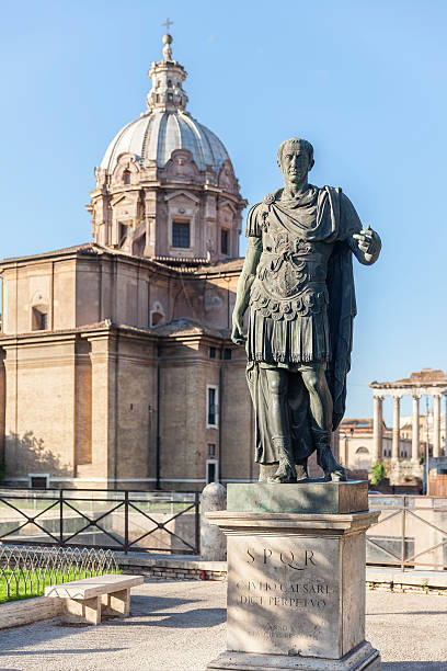 Statue Roman Emperor in with church in Rome stock photo