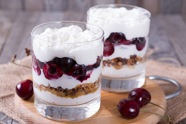 istock Yogurt, oatmeal and berries in a glass 584889888