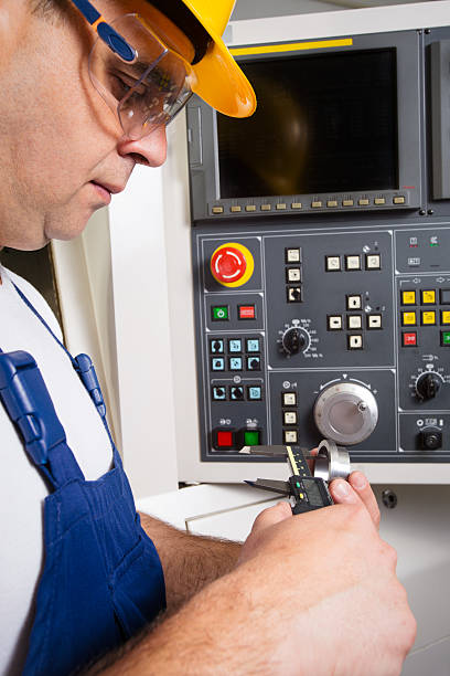 istock Worker measuring steel detail with digital Vernier Caliper at workshop 584891004