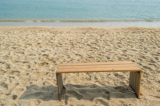 istock chair wood on the beach 584891234