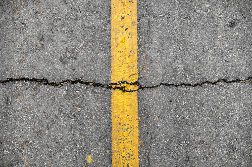 Crack on line yellow on road textured