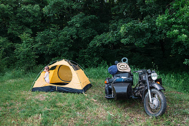 istock Motorcycle with sidecar parked on green grass 584892698